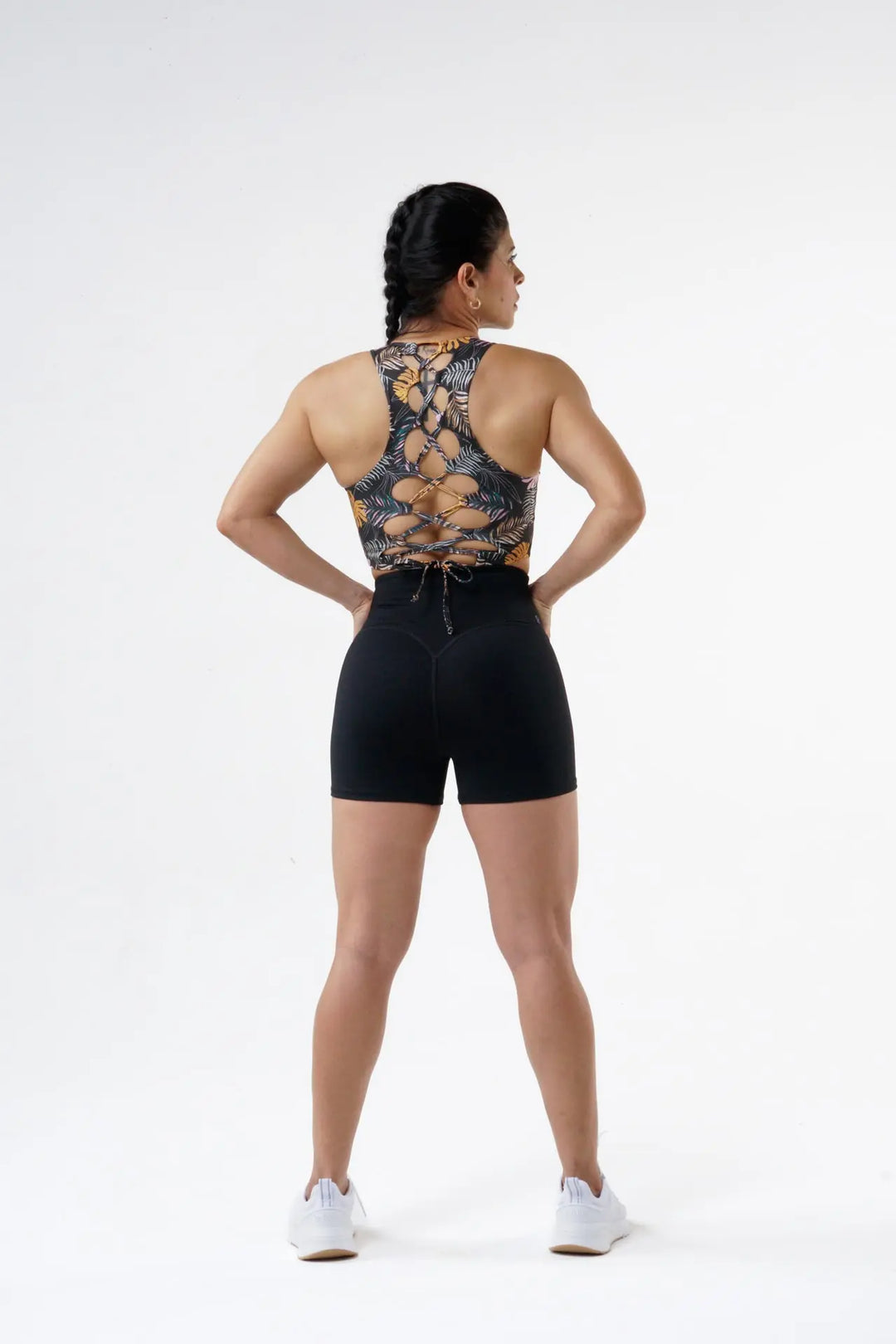 Woman wearing the Daisy High Impact Adjustable of color dark tropical print#color_dark-tropical-print
