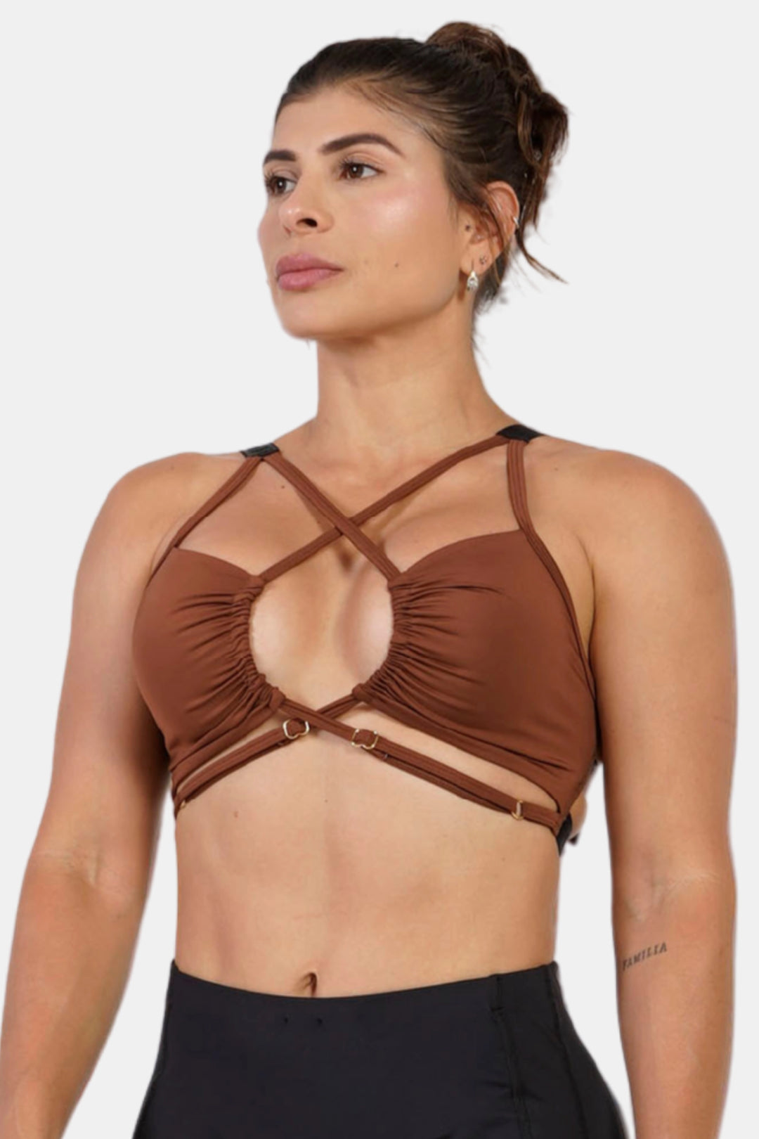 Woman wearing a brown strappy top against a white background #color_cappuccino