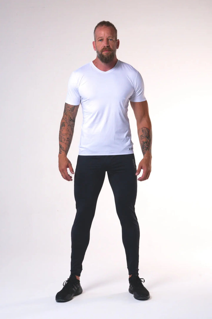Man wearing the Odin functional athlete tee shirt of color white#color_white