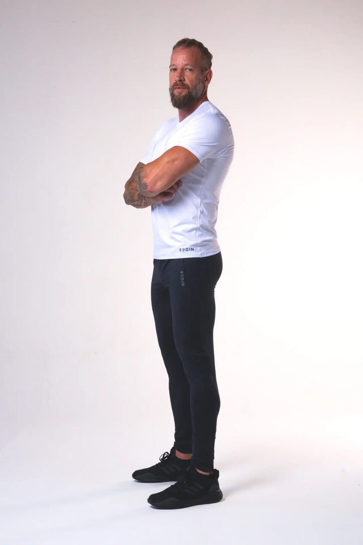 Man wearing the Odin functional athlete tee shirt of color white#color_white