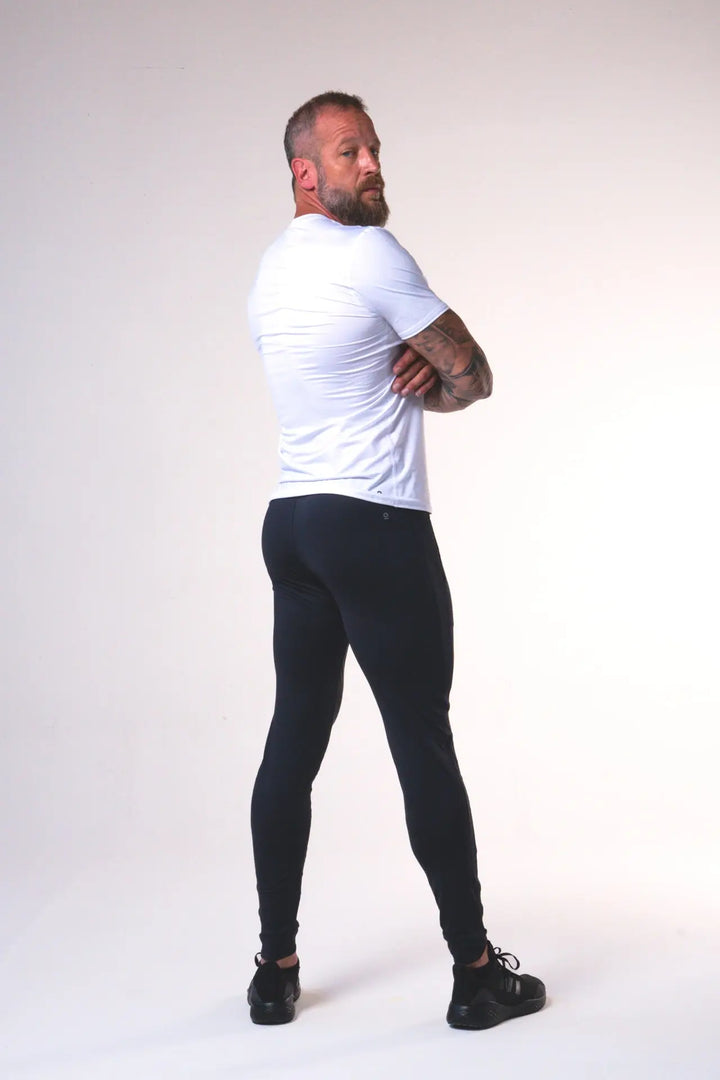 Man wearing the Odin functional athlete tee shirt of color white#color_white