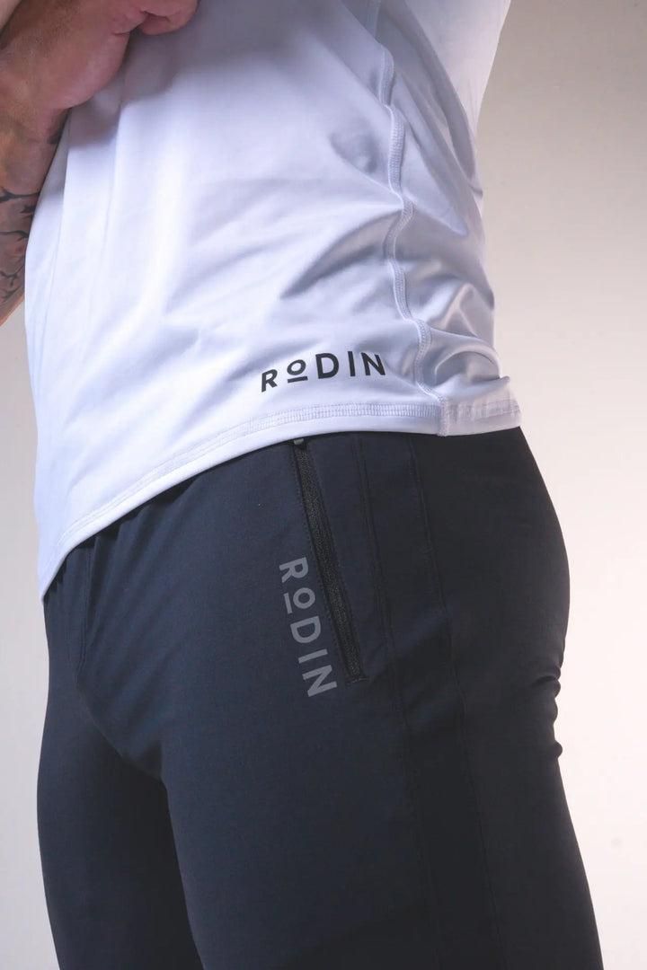 Man wearing the Odin functional athlete tee shirt of color white#color_white