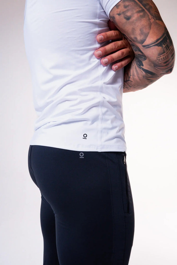 Man wearing the Odin functional athlete tee shirt of color white#color_white