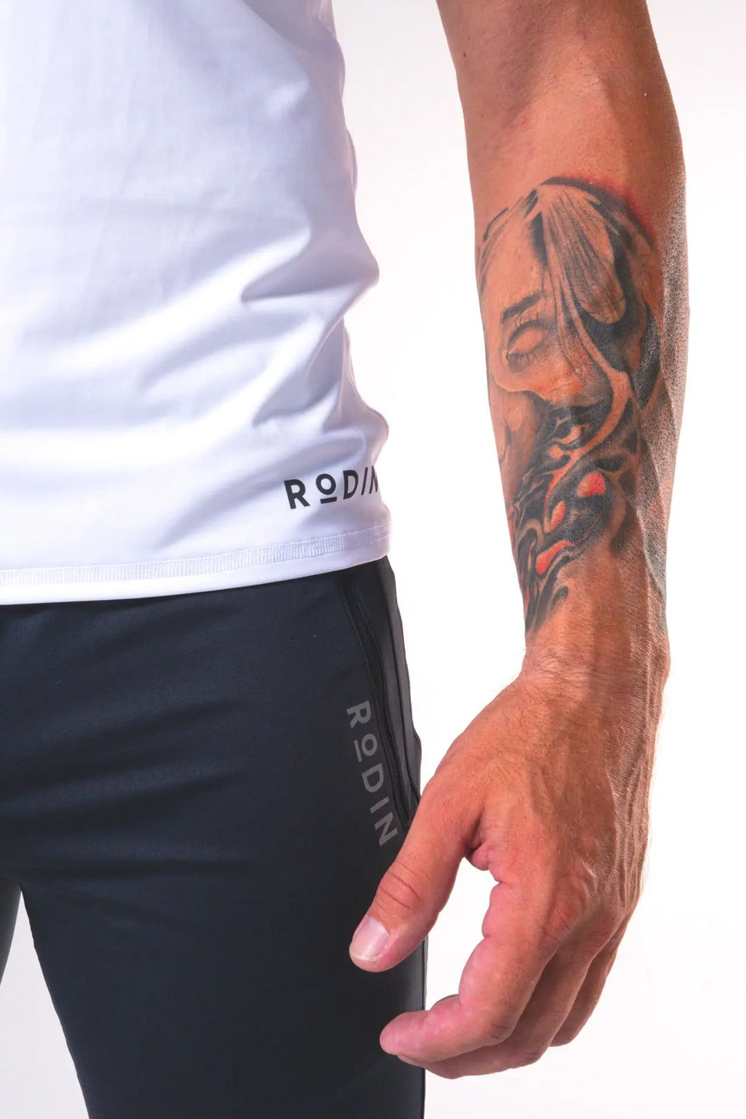 Man wearing the Odin functional athlete tee shirt of color white#color_white