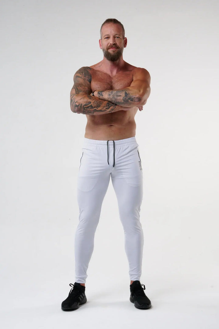 Man wearing the Rogan functional athlete jogger of color white#color_white