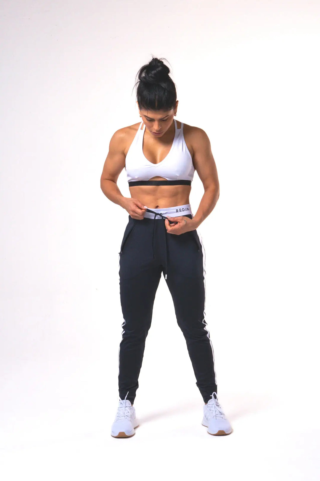 Woman wearing the Shasta functional jogger of color black#color_black